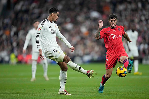 La Liga 2024-25: Real Madrid's Jude Bellingham challenges for the ball with Sevilla's Isaac Romero 