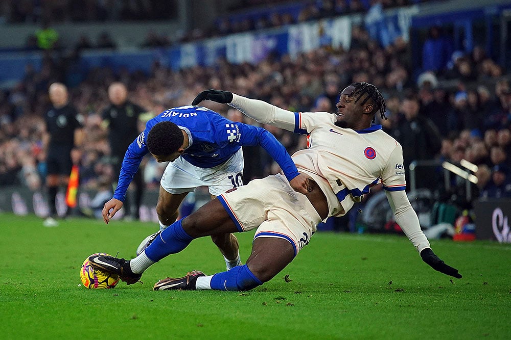 | Photo: Peter Byrne/PA via AP : EPL 2024-25: Chelsea's Axel Disasi, right, fouls Everton's Iliman Ndiaye 