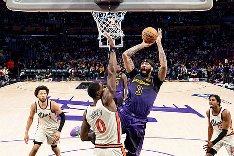 NBA 2024-25: Lakers forward Anthony Davis shoots over Pistons center Jalen Duren