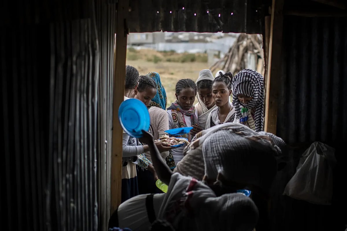 Tigrayans stand in line to receive food in Tigray region of Ethiopia on May 9, 2021 | - AP
