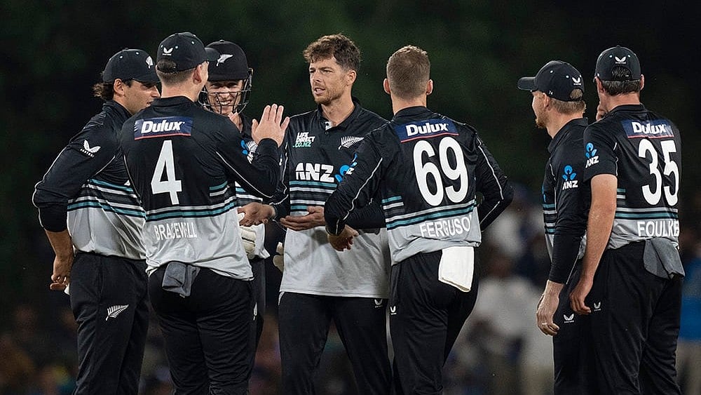 New Zealand's team members congratulate Mitchell Santner for the wicket of Sri Lanka's Kusal Mendis. - | Photo: AP/Eranga Jayawardena