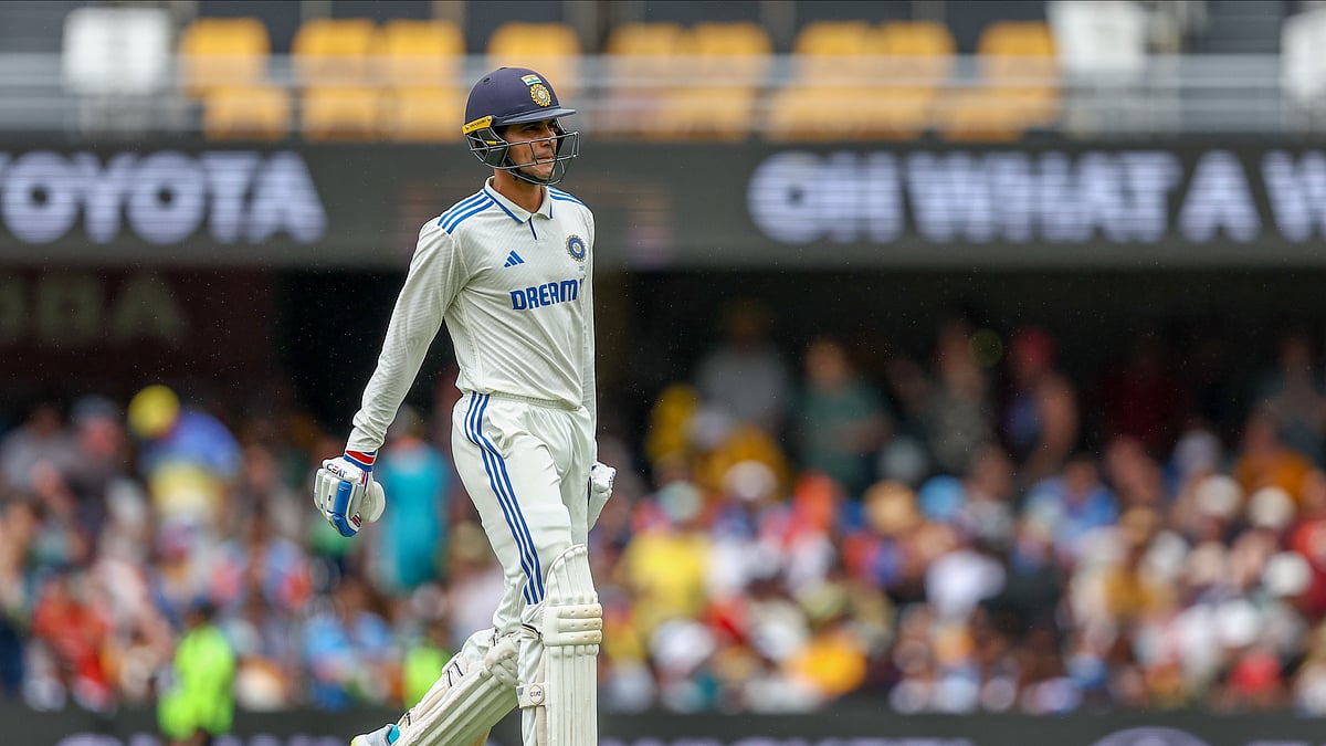 AP Photo/Pat Hoelscher : Shubman Gill walks off the field after losing his wicket during play on day three of the third cricket test between India and Australia at the Gabba in Brisbane.