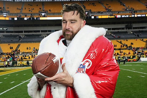 NFL Football: Chiefs tight end Travis Kelce (87) holds a football
