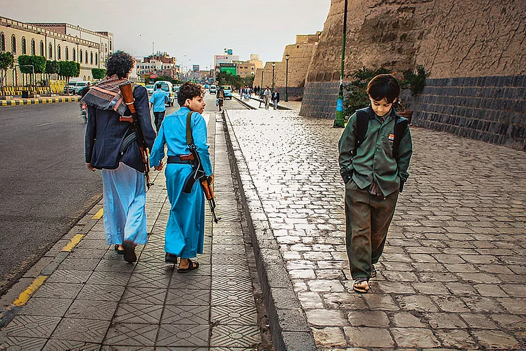 Contrasting Journeys: One boy goes to school, the other suffers the war - | Photos: Ali Al-Senaidar