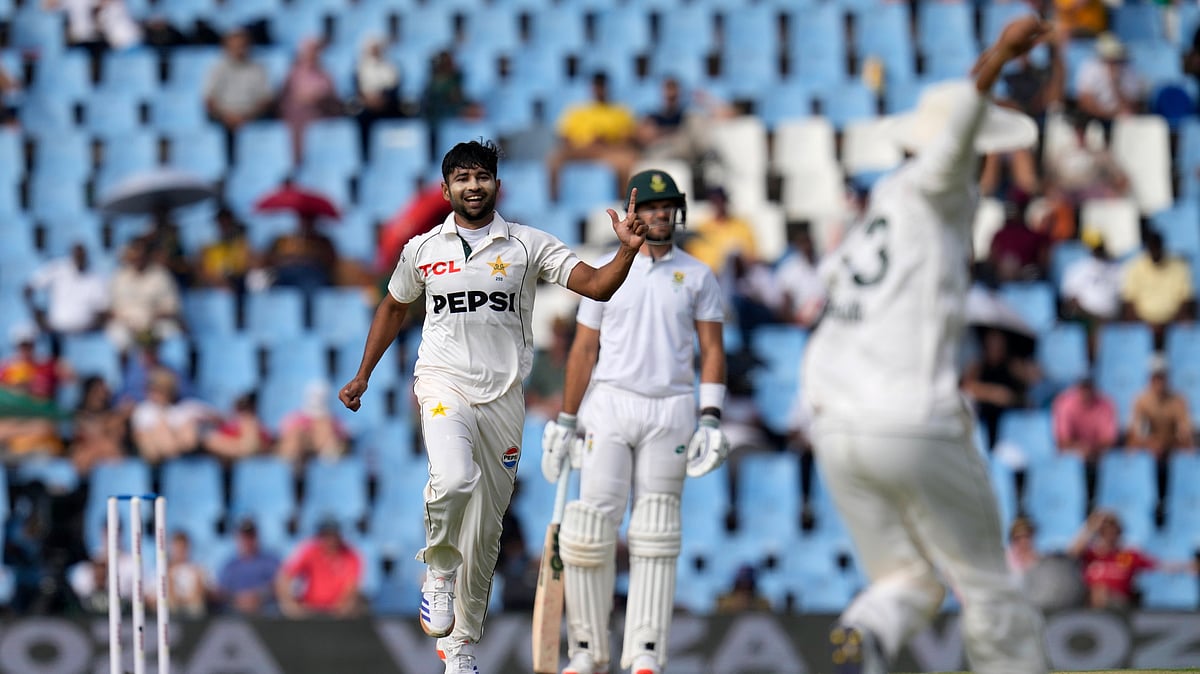 AP Photo/Themba Hadebe : Pakistan's Khurram Shahzad, left, celebrates after dismissing South Africa's Ryan Rickelton during day one of the Test cricket match between South Africa and Pakistan at Centurion Park in South Africa.