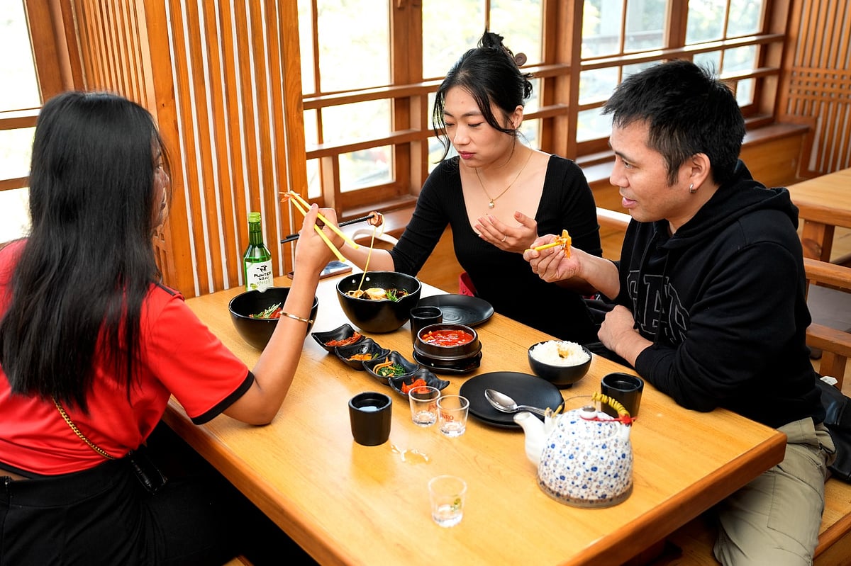 A group of friends enjoys authentic Korean cuisine at Gangnam Korean Restaurant in Majnu-ka-Tilla.