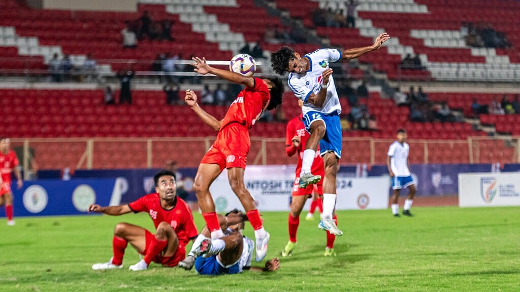 AIFF : Kerala (in whites) in action against Manipur in the Santosh Trophy 2024-25 semi-final.