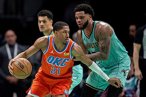 NBA: Hornets forward Miles Bridges (0) guards Thunder guard Aaron Wiggins