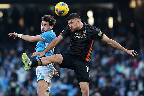 Serie A 2024-25: Napoli's Khvicha Kvaratskhelia and Venezia's Giorgio Altare in action 