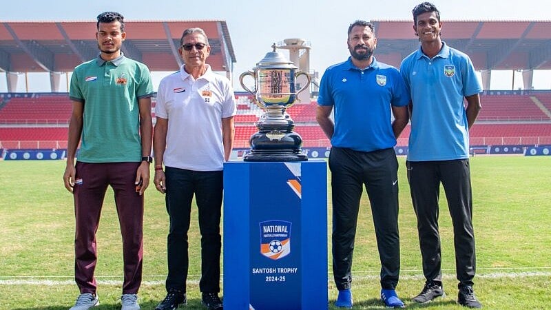 AIFF Media : Players and coaches pose with the trophy ahead of the Santosh Trophy final between West Bengal and Kerala.