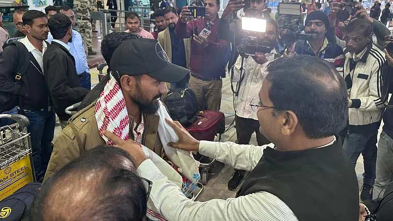 The stranded workers are greeted by the Labour Department and Press at the airport