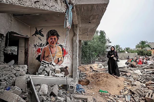 Resistance Art: A ‘Free Gaza’-themed mural titled ‘Invasion Kills Children’ made by Palestinian artists on the walls of demolished houses in Deir al-Balah city in Gaza - Getty Images
