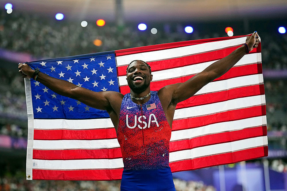 | Photo: AP/Petr David Josek, File : Noah Lyles after winning at Paris Olympics.