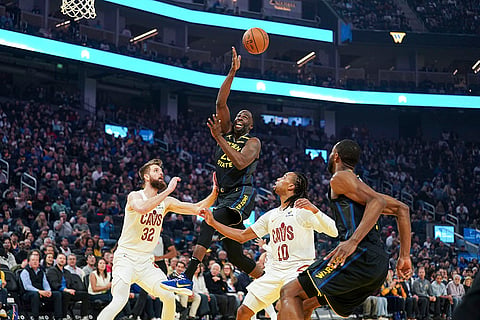 NBA 2024-25: Warriors forward Draymond Green, center, passes the ball 