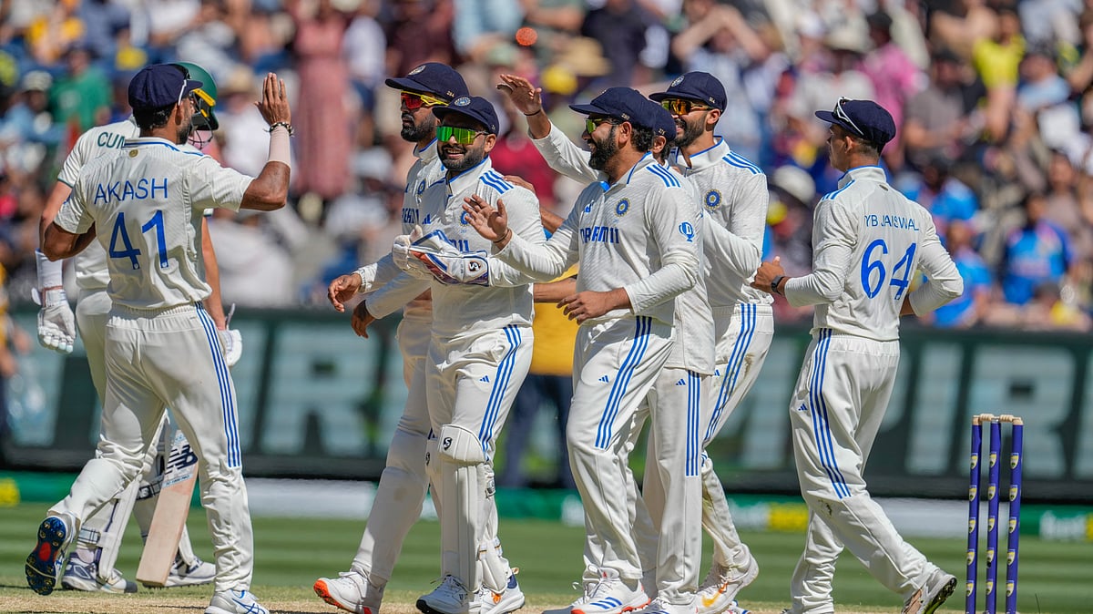 Indian players celebrate the wicket of Australias Mitchell Starc. AP Photo