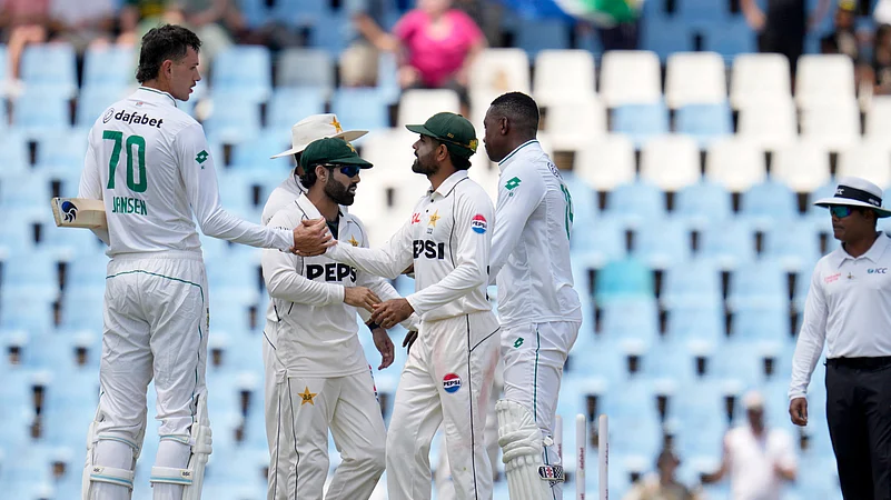 South Africas Marco Jansen, left, shakes hands with Babar Azam. AP Photo