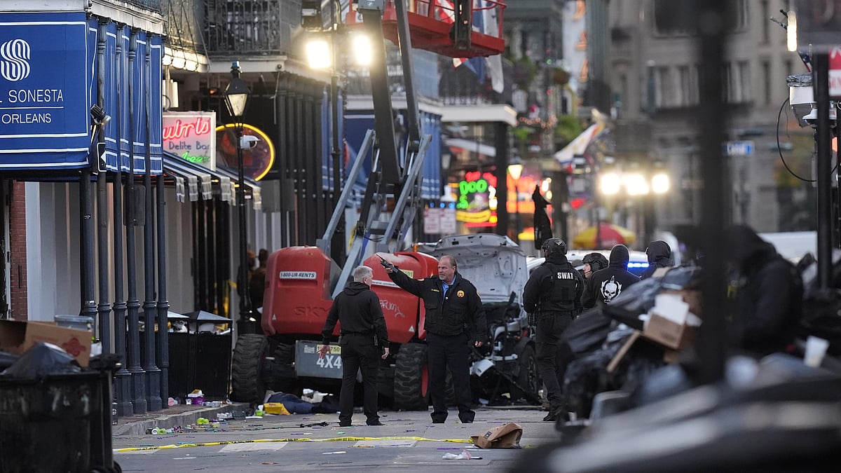  (AP Photo/Gerald Herbert) : EDS NOTE: GRAPHIC CONTENT - Emergency personnel work the scene on Bourbon Street after a vehicle drove into a crowd on New Orleans' Canal and Bourbon Street, Wednesday Jan. 1, 2025.