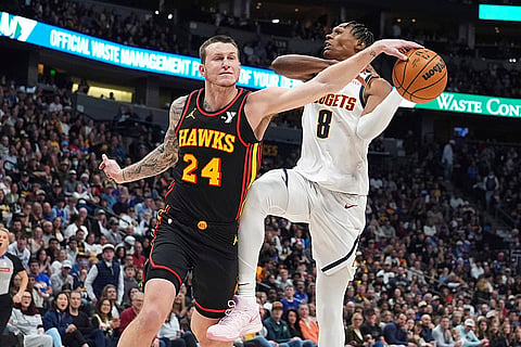 NBA 2024-25: Hawks guard Garrison Mathews knocks the ball out of the hands of Nuggets forward Peyton Watson