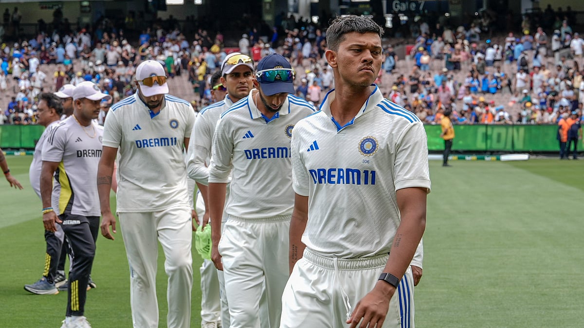 Indian players walk off the field after losing the fourth test. AP Photo