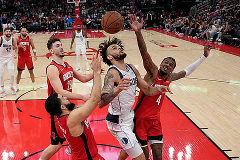 NBA 2024-25: Mavericks' Dereck Lively II (2) loses the ball 