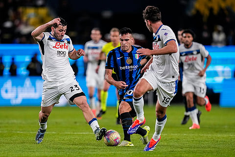 Italian Super Cup 2024-25: Inter Milan's Lautaro Martinez duels for the ball with Atalanta's Sead Kolasinac and Berat Djimsiti 