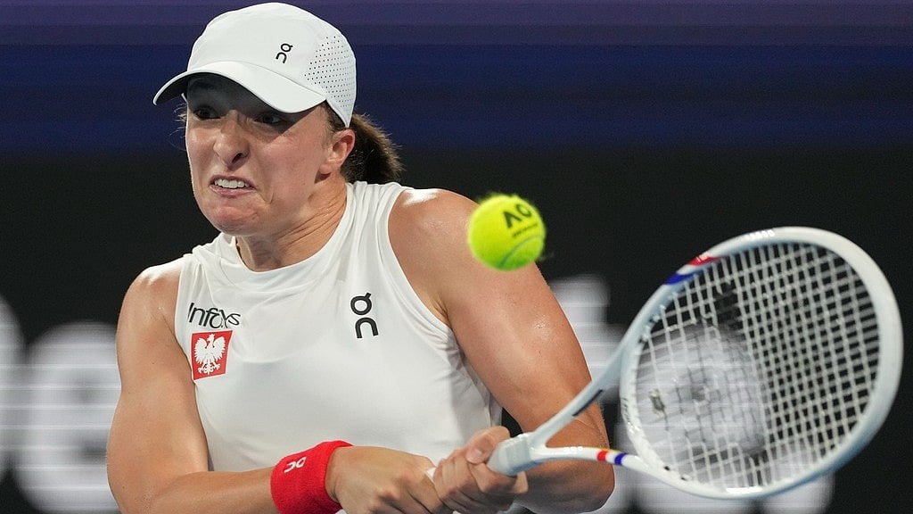 AP : Poland's Iga Swiatek plays a backhand against Britain's Katie Boulter during their quarter-final match at the United Cup. 