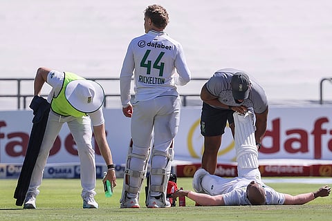 SA vs PAK 2nd test Day 1: South Africa's Temba Bavuma, right, receives medical attention 