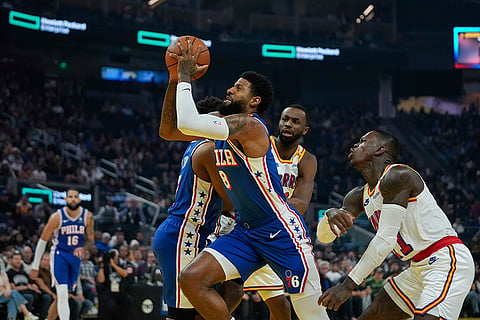 NBA 2024-25: 76ers forward Paul George (8) moves the ball while defended by Warriors guard Dennis Schröder