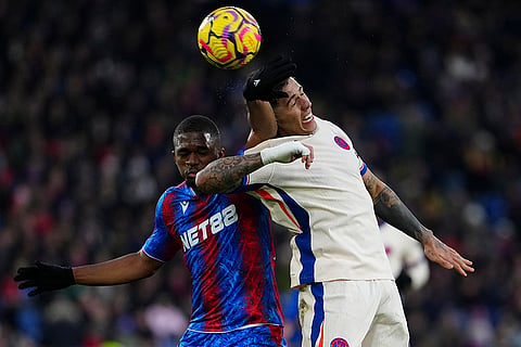 EPL 2024-25: Crystal Palace's Cheick Doucoure, left, and Chelsea's Enzo Fernandez go for the ball