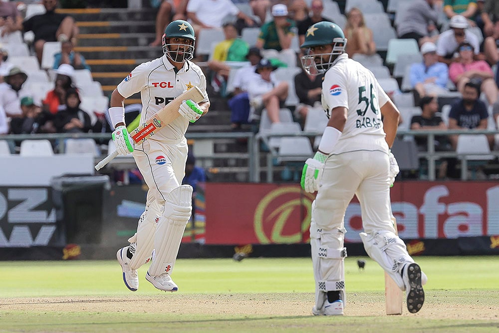 | Photo: AP/Halden Krog : SA vs PAK 2nd Test Day 3: Pakistan's Shan Masood (c) and Pakistan's Babar Azam run between the wickets