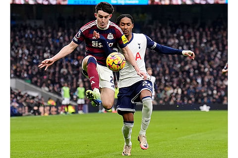 EPL 2024-25: Newcastle United's Tino Livramento, left, and Tottenham Hotspur's Djed Spence battle for the ball