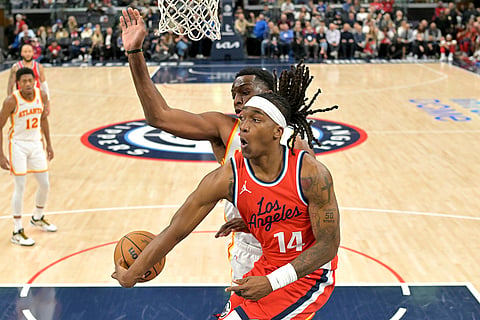 NBA 2024-25: Clippers guard Terance Mann (14) makes a pass