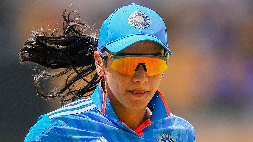 Photo: PTI/Shailendra Bhojak : India's Smriti mandhana in action