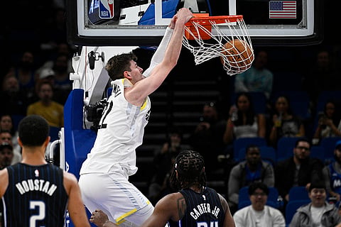 NBA 2024-25: Jazz forward Kyle Filipowski (22) dunks
