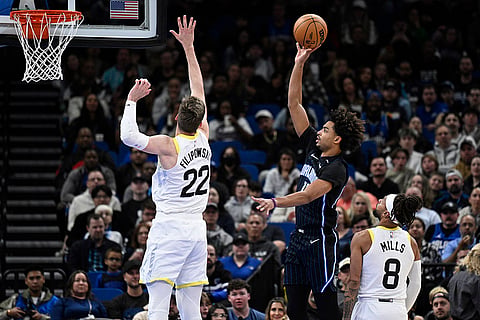 NBA 2024-25: Magic guard Jett Howard, second from right, goes up to shoot 