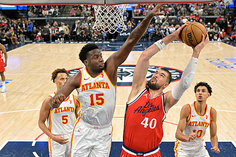 NBA 2024-25: Hawks center Clint Capela (15) defends a shot by Clippers center Ivica Zubac