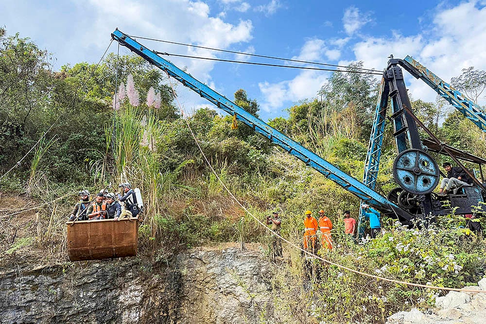 Rescue operation underway Labourers trapped inside a coal mine in Assam photo: 5
