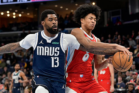 NBA 2024-25: Mavericks forward Naji Marshall (13) and Grizzlies forward Jaylen Wells (0) struggle for control of the ball