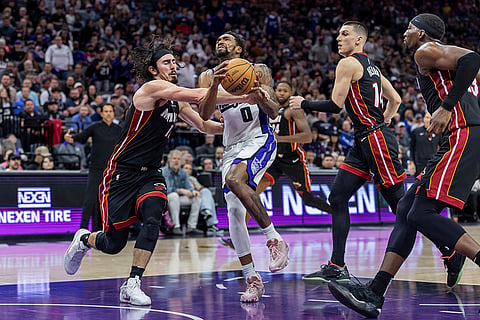 NBA 2024-25: Kings guard Malik Monk (0) drives to the basket