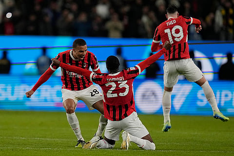 Italian Super Cup Final: AC Milan's Fikayo Tomori, center, celebrates with teammates after winning the final