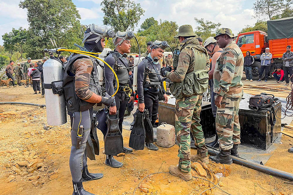 Photo: PTI : Rescue operation underway Labourers trapped inside a coal mine in Assam