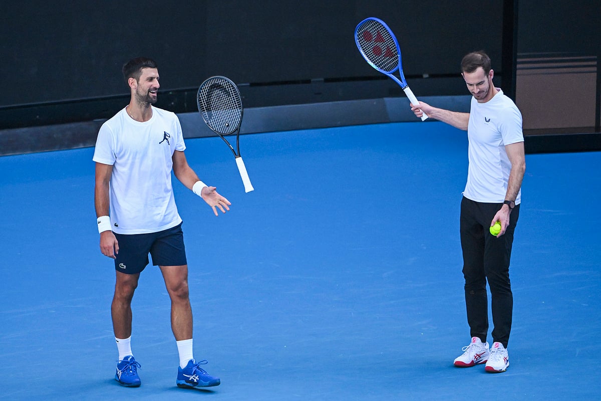 (James Ross/AAP Image via AP) : Novak Djokovic of Serbia, left, and coach Andy Murray react during a training session ahead of the Australian Open tennis tournament at Melbourne Park in Melbourne, Tuesday, Jan. 7, 2025. 
