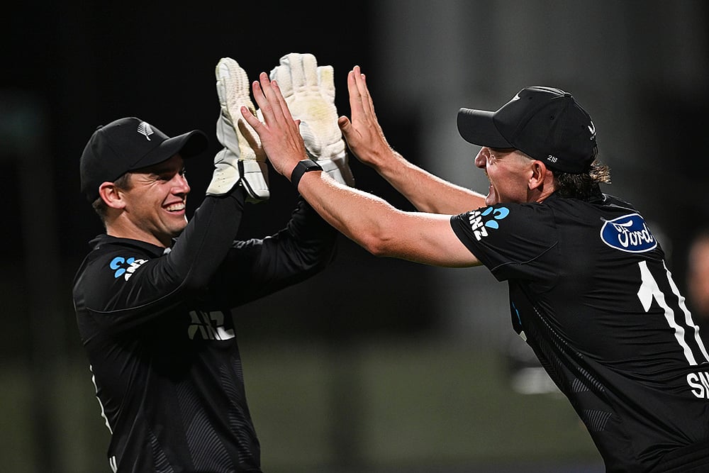 | Photo: Andrew Cornaga/Photosport via AP : NZ vs SL 2nd ODI: New Zealand's Nathan Smith celebrates with Tom Latham after taking a catch to dismiss Eshan Malinga