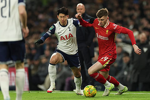 EFL Cup Semi-Final: Tottenham's Son Heung-min duels for the ball with Liverpool's Conor Bradley 