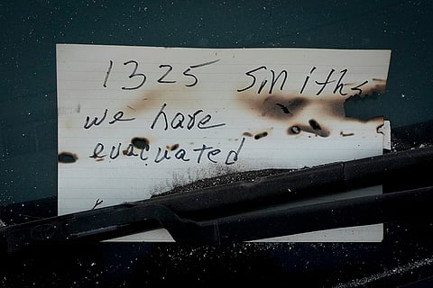A sign reads 'we have evacuated' 
