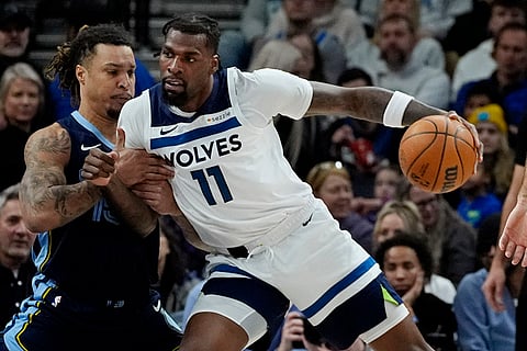 NBA 2024-25: Timberwolves center Naz Reid (11) works against Grizzlies center Brandon Clarke