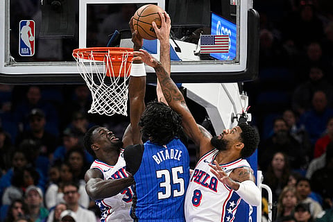 NBA 2024-25: Magic center Goga Bitadze (35) has his shot blocked by 76ers center Adem Bona