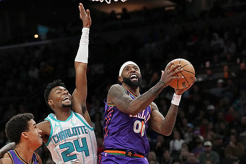 NBA 2024-25: Suns forward Royce O'Neale (00) drives past Hornets forward Brandon Miller