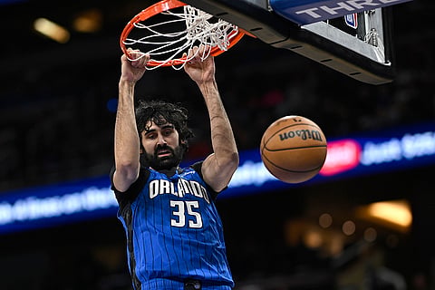 NBA 2024-25: Magic center Goga Bitadze dunks against the 76ers