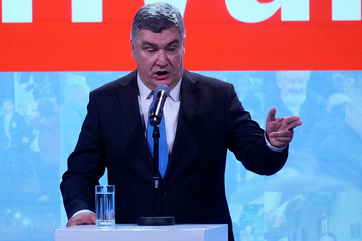 AP Photo/Darko Bandic : President incumbent Zoran Milanovic addresses his supporters as the preliminary results grant him victory in a runoff vote for the Croatian presidential election in Zagreb, Croatia, Sunday, Jan. 12, 2025. The sign reads "Thank You". 
